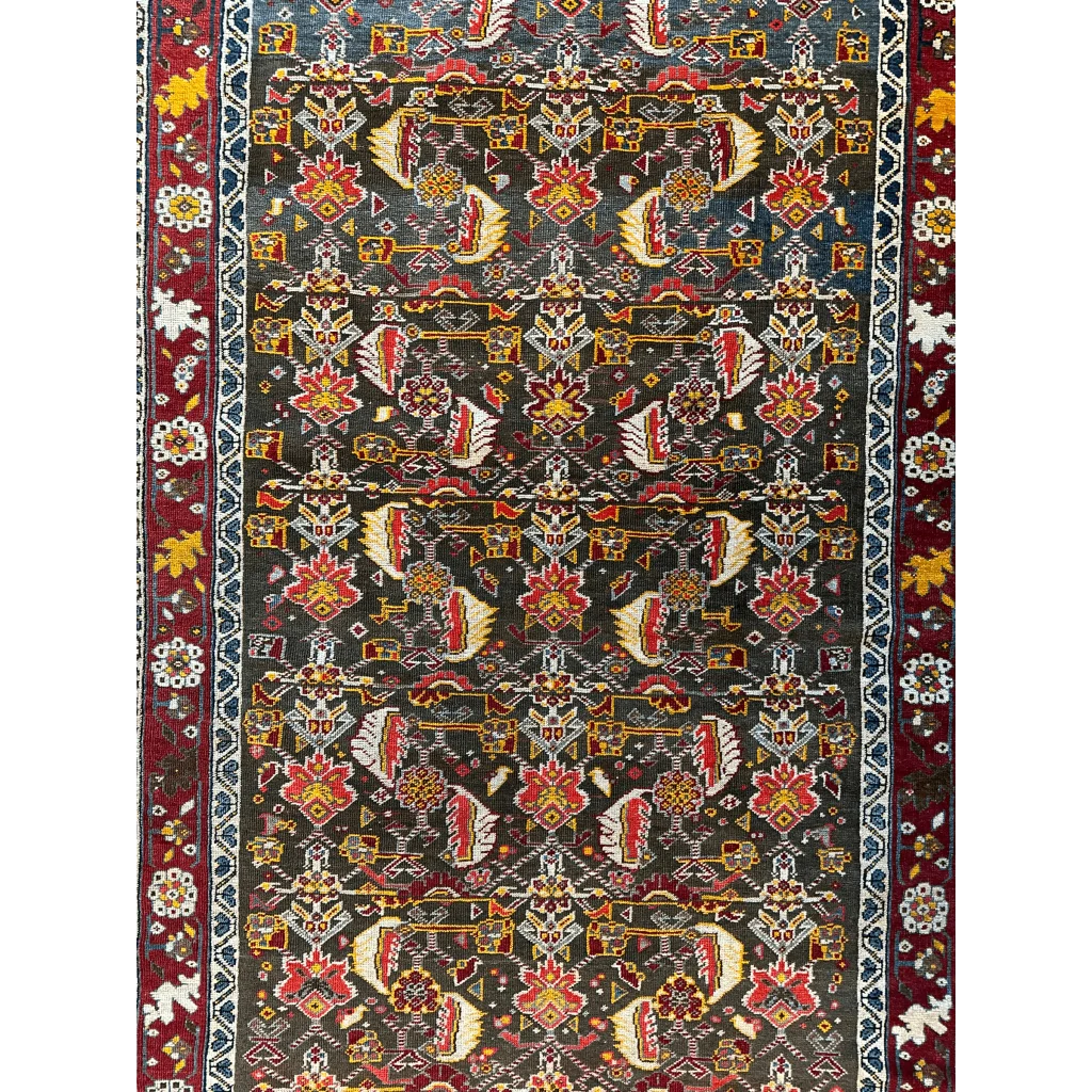 1920s Persian Kashkuli rug, dark blue ground with intricate geometric floral field patterns, hand-knotted