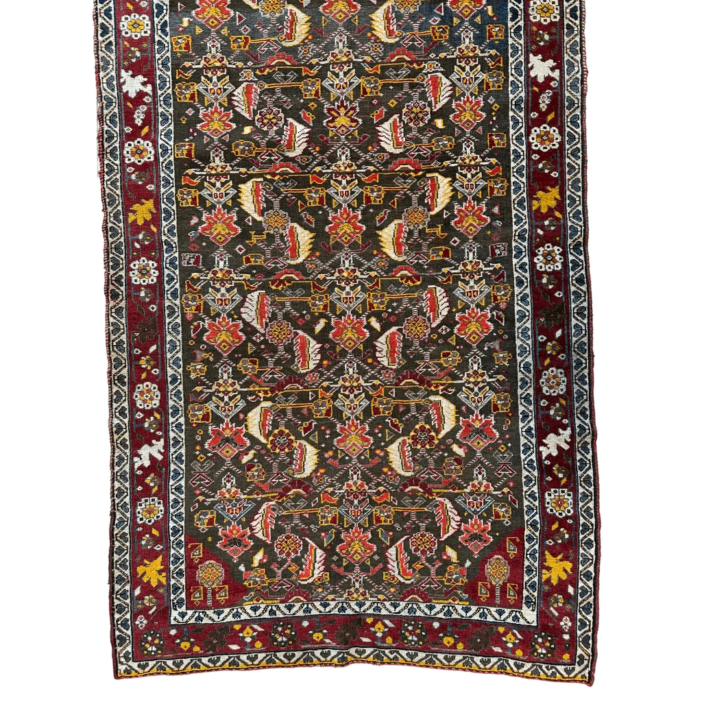 1920s Persian Kashkuli rug, field pattern detail showing fine knot density and intricate design, natural dyes