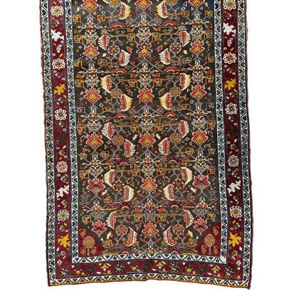 1920s Persian Kashkuli rug, field pattern detail showing fine knot density and intricate design, natural dyes