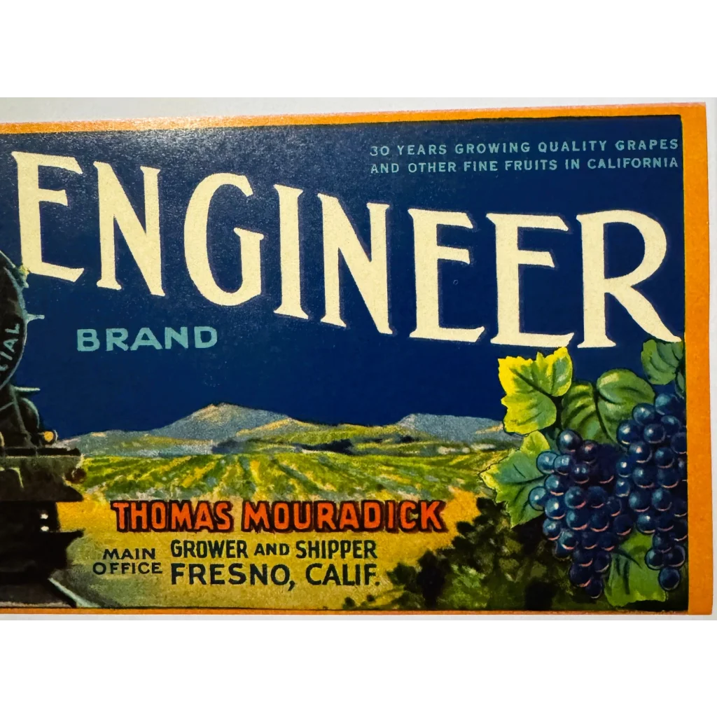 Vintage fruit crate label from 1930s Fresno Featuring locomotive engineer crate design