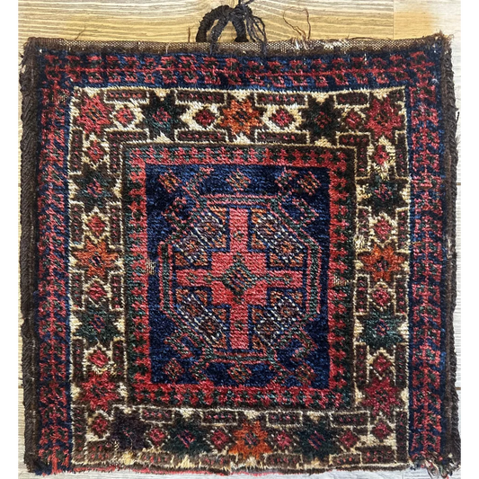 Rare 1950s Persian complete bag with blue rug featuring red cross motif