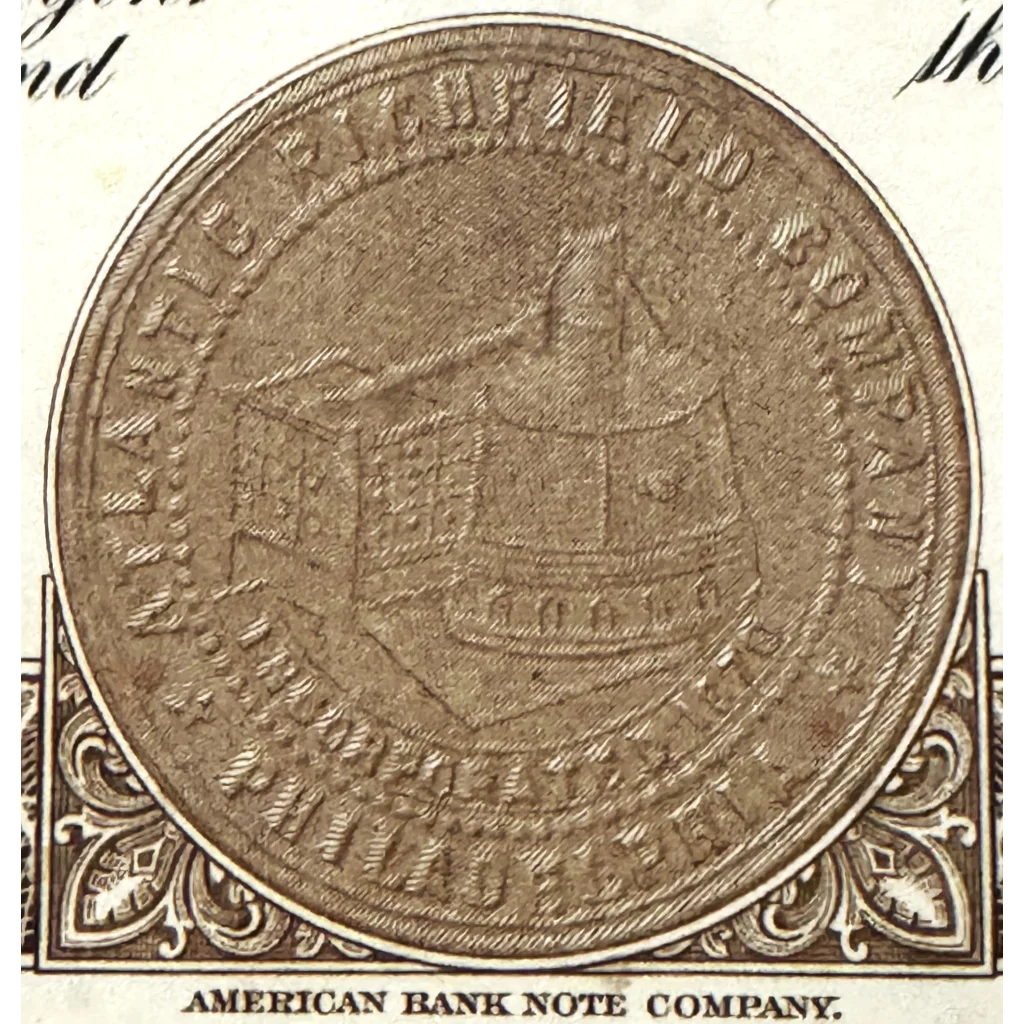 Circular coin showing building with columns, from Vintage 1960s Atlantic Richfield stock certificate