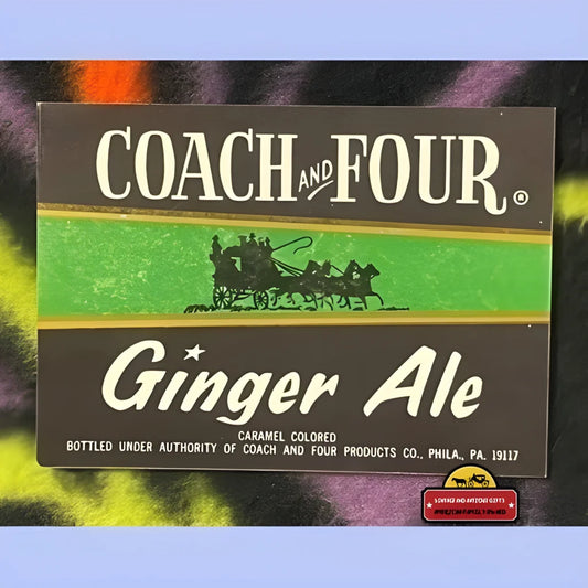 Vintage Coach and Four Ginger Ale label showcasing horse-drawn carriage silhouette