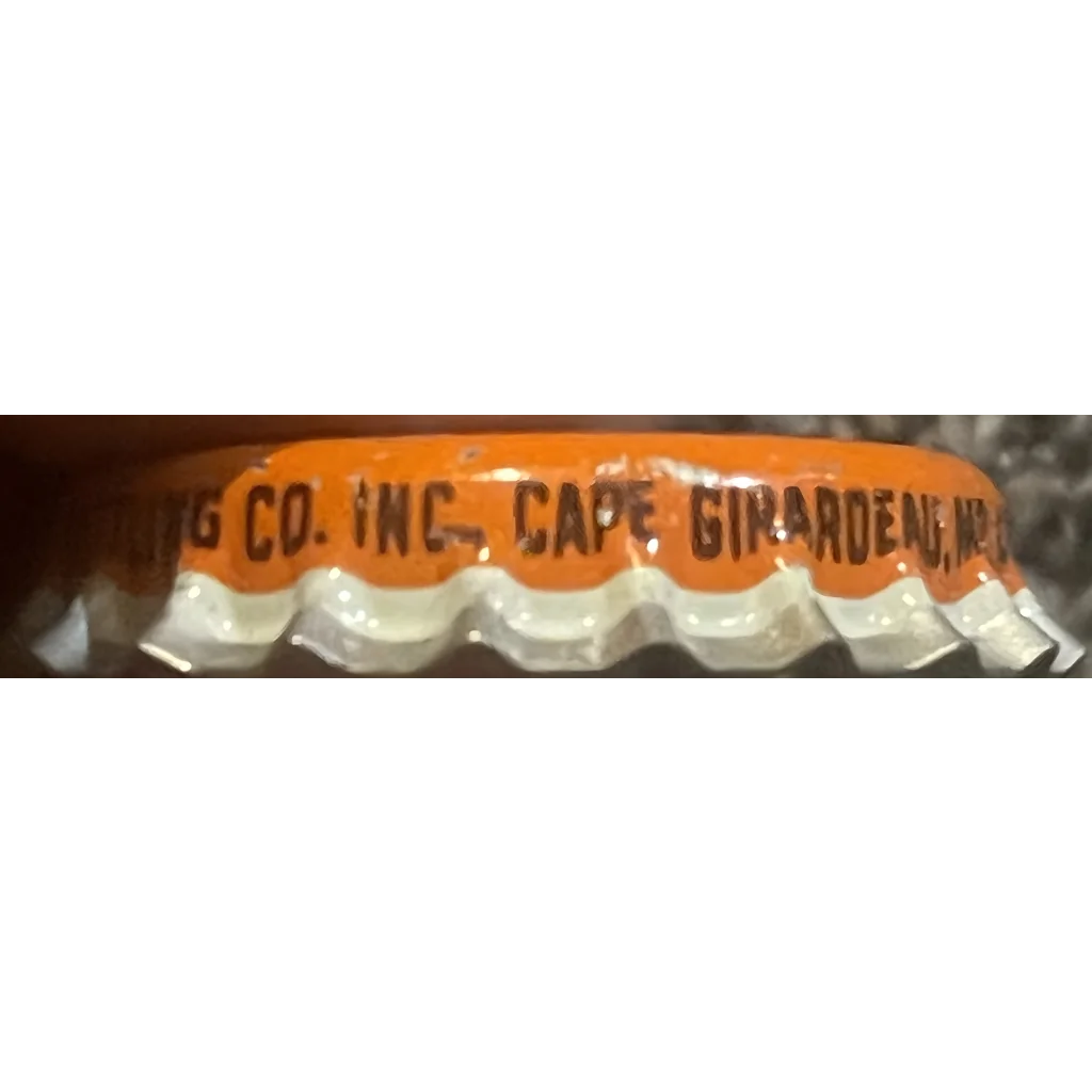 Carton of eggs with orange text atop a collectible Rare 1960s Hires Draft Root Beer cap