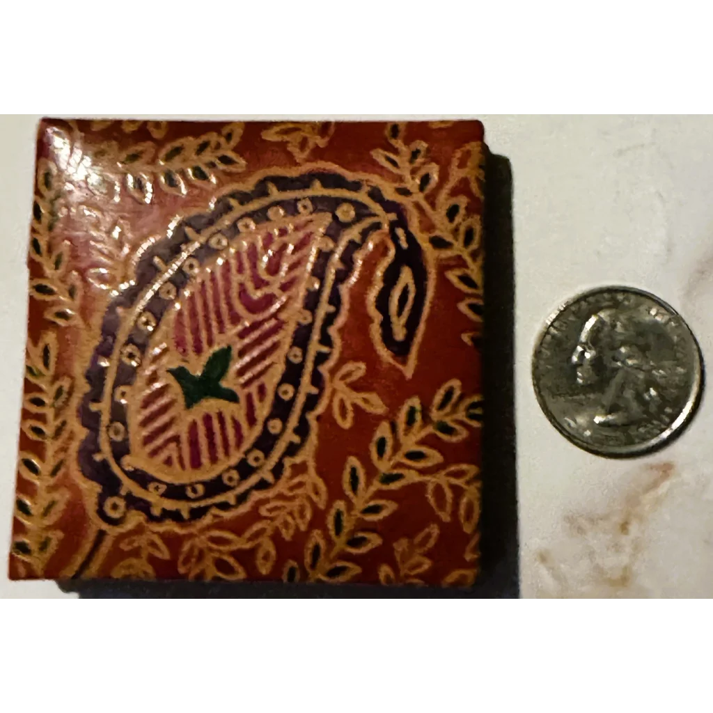 Brown leather wallet with paisley and floral design in a vintage 1960s Indian purse