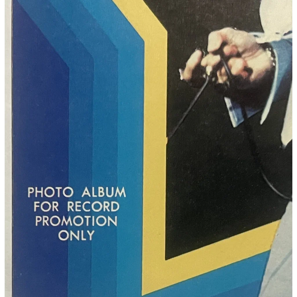 Photo album cover featuring a partial image of 1970s Elvis Presley performing live