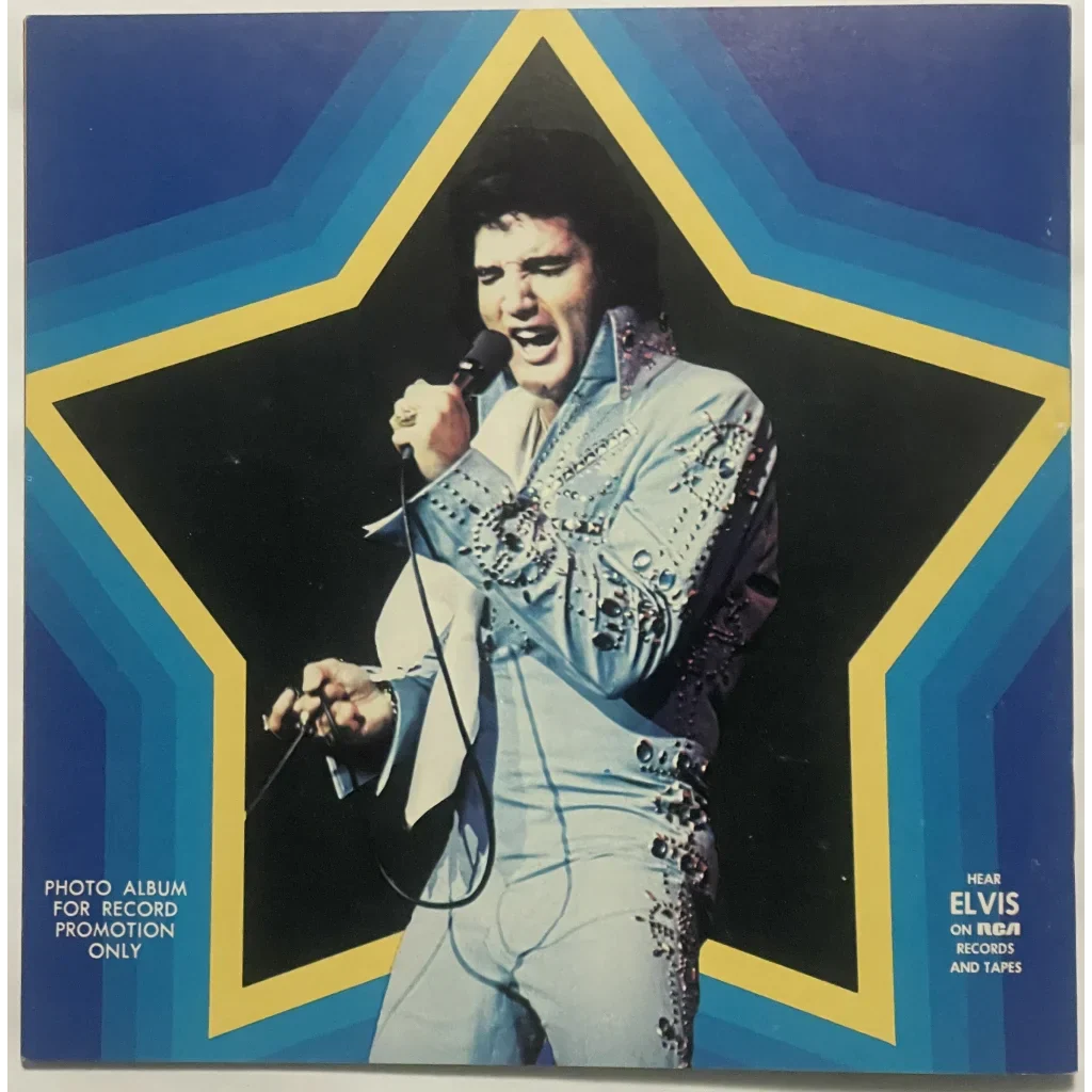 Elvis Presley in a white embroidered jumpsuit singing at a 1970s concert