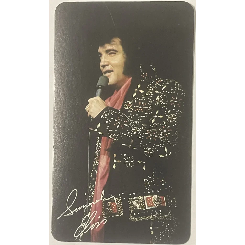 Performer in glittery jumpsuit with microphone, featured in Elvis Presley card calendar