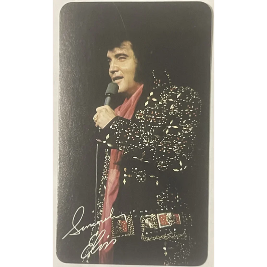 Performer in glittery jumpsuit with microphone, featured in Elvis Presley card calendar