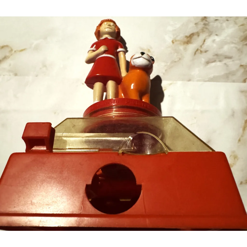 Red View-Master toy with figures atop in Rare 1981 Annie Coin Bank collection