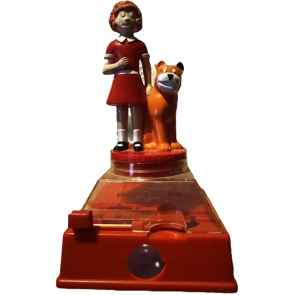 Red plastic coin bank with Annie in a dress and dog, perfect for collectors