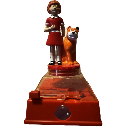 Red plastic coin bank with Annie in a dress and dog, perfect for collectors