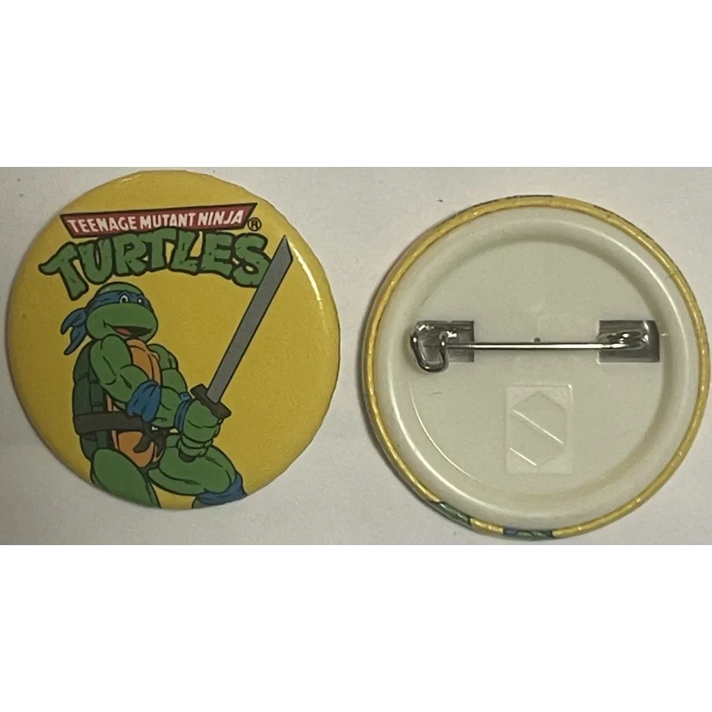 Leonardo pin-back button from the Rare 1990 Ninja Turtles Movie on a bright yellow background