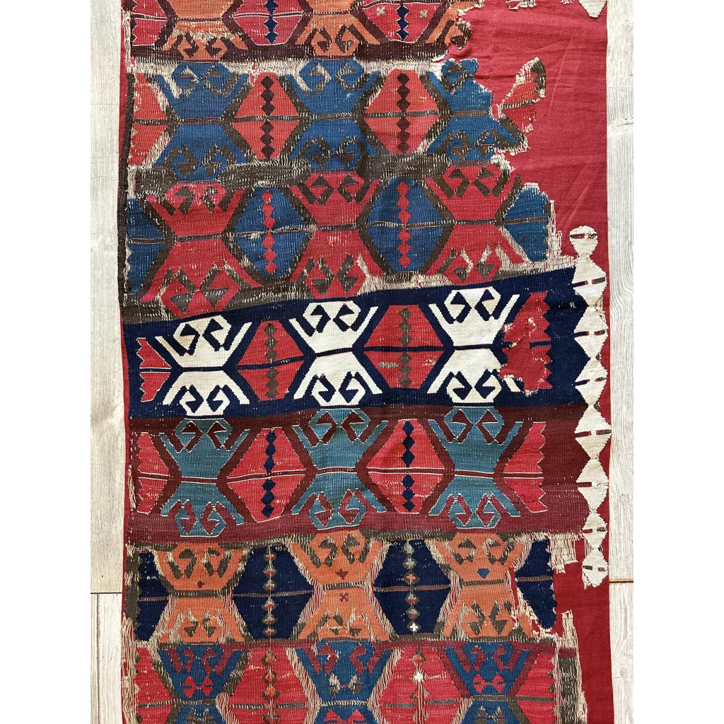 Antique Anatolian kilim fragment with geometric hexagon patterns in madder red indigo and ivory