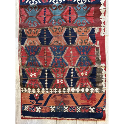 Antique 19th century Anatolian kilim fragment, close-up of hand-spun wool and natural madder dye