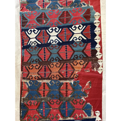 Madder red hand-woven kilim fragment Central Anatolia, detail of tribal hook medallion motifs