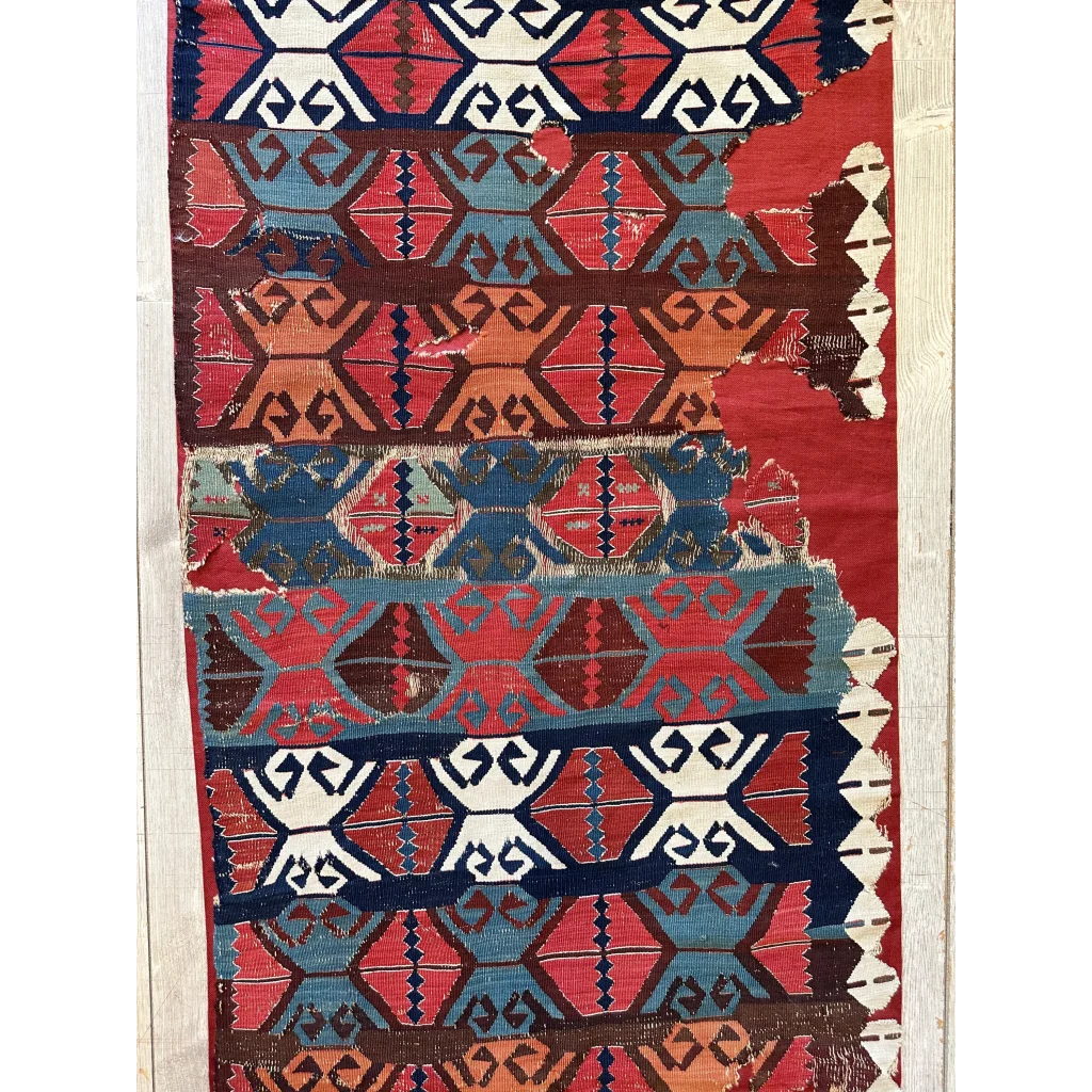 Vibrant 19th-century Anatolian hand-woven kilim fragment in madder red