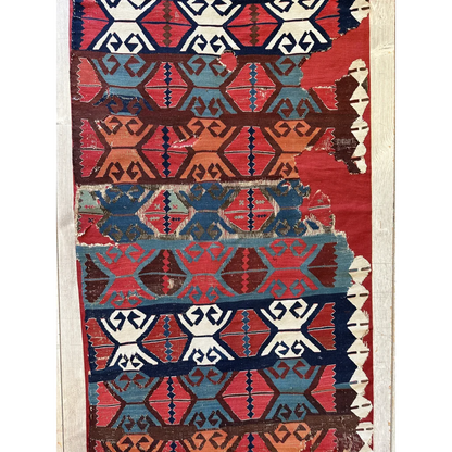 Vibrant 19th-century Anatolian hand-woven kilim fragment in madder red