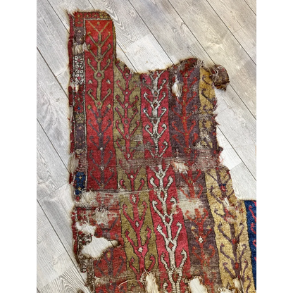 Antique Anatolian rug fragment 19th century, olive gold vine motifs on madder red, Central Anatolia