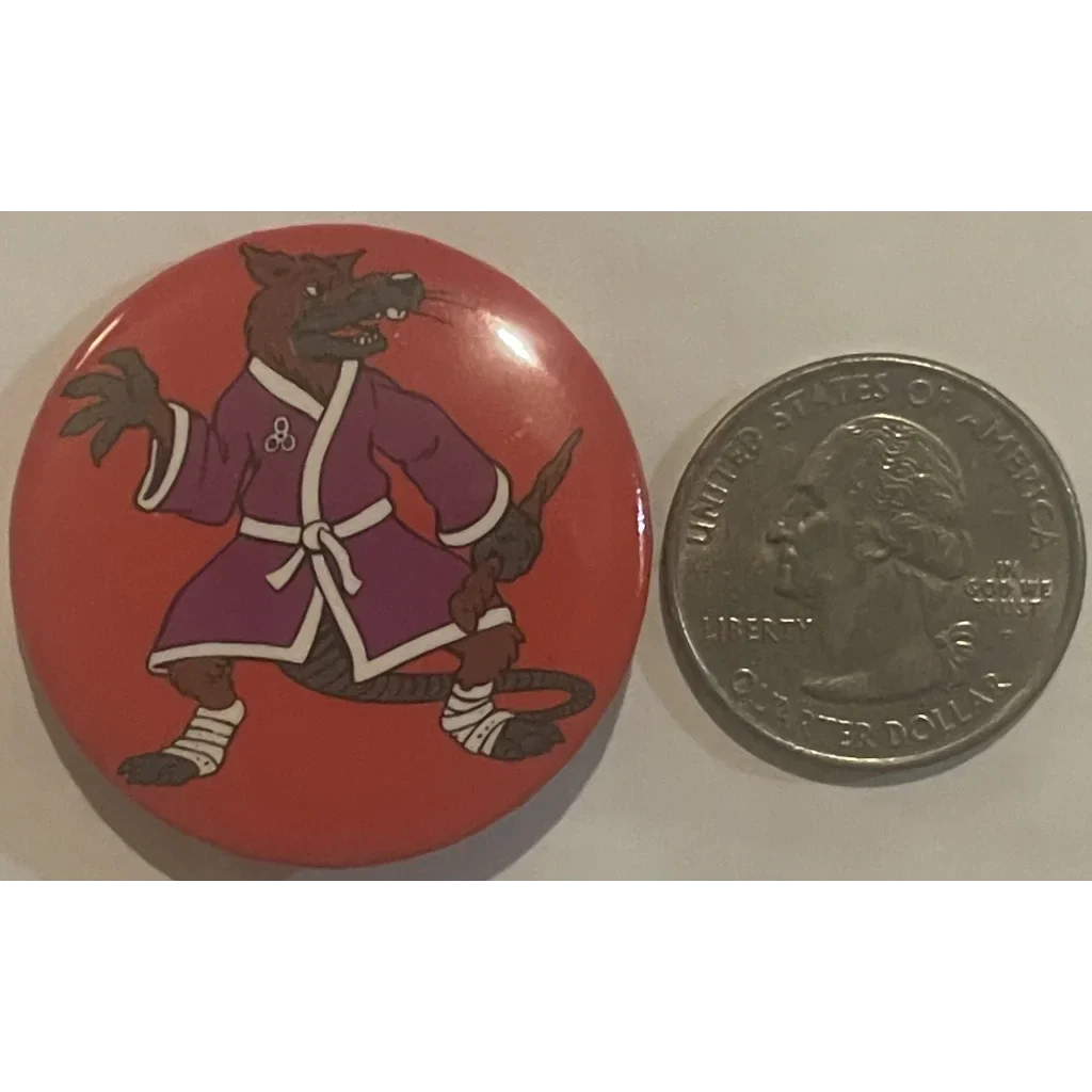 Circular pin featuring a cartoon rat in a purple robe from Ninja Turtles movie