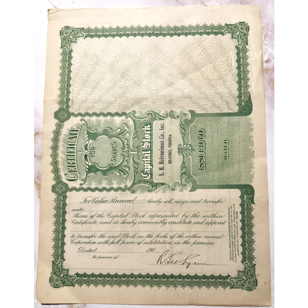 Vintage green Heironimus stock certificate with ornate border and blank details