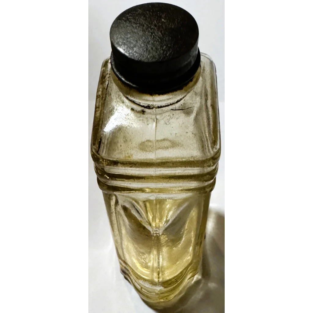 Yellow glass vintage bottle with black cap, rare collectible bottle brilliantine