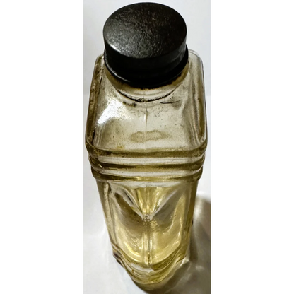 Yellow glass vintage bottle with black cap, rare collectible bottle brilliantine