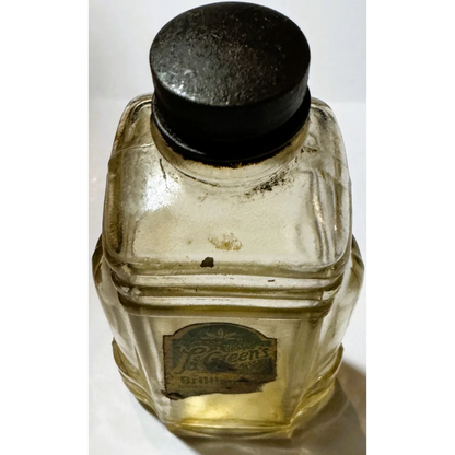 Vintage glass bottle with black cap and label, a unique collectible bottle brilliantine