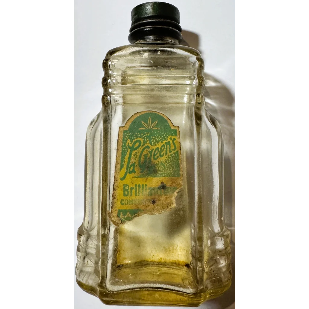Vintage glass bottle with green label and black cap, collectible bottle brilliantine