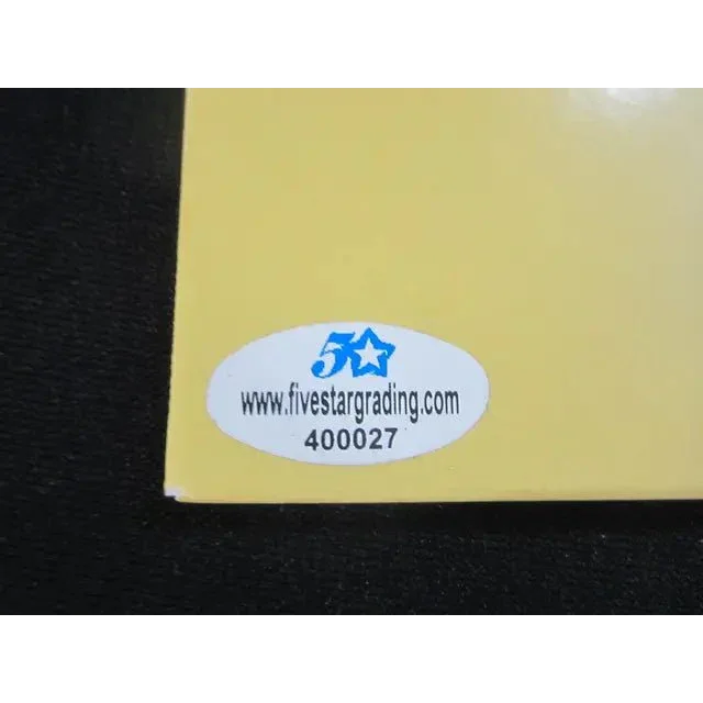 Yellow rectangular object with white sticker from Rare Billie Eilish Signed Vinyl Record Album