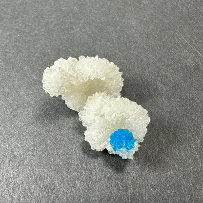 Rare blue cavansite crystal cluster from India with translucent white formations and vibrant core