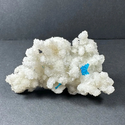 Rare blue cavansite crystal on white stilbite from India