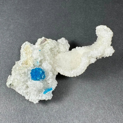 Rare blue cavansite crystal on white stilbite from India