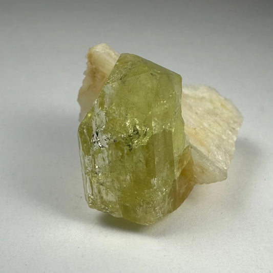 Rare translucent yellow-green Brazilianite crystal with Albite inclusions from Minas Gerais, Brazil