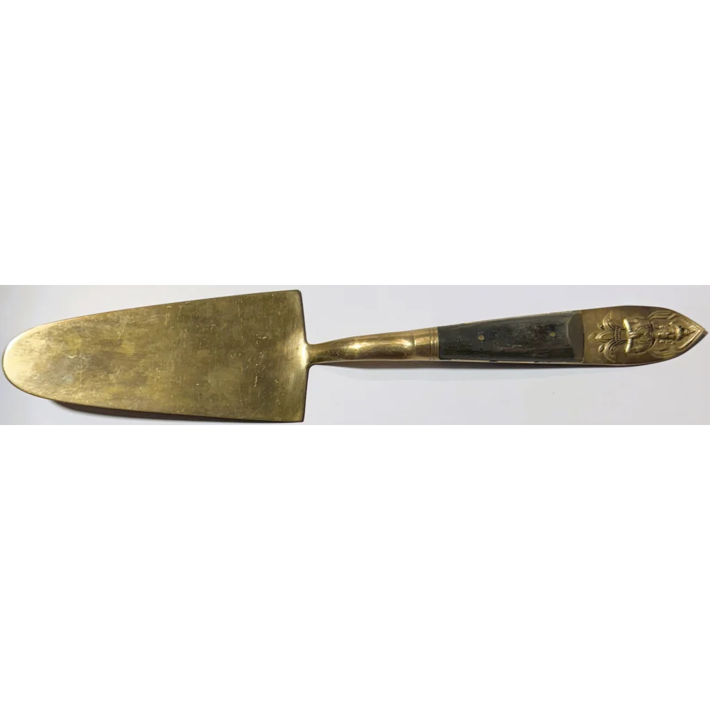 Rare Century Exclusive Willy Schlegelmilch antique brass cake server with fleur-de-lis handle