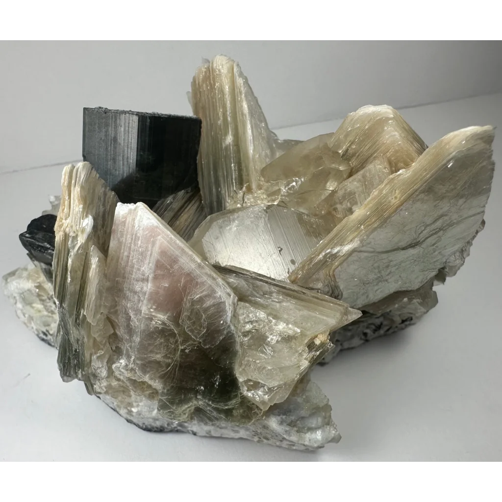 Rare indicolite tourmaline crystal from Afghanistan with pale greenish-yellow crystals and black inclusions