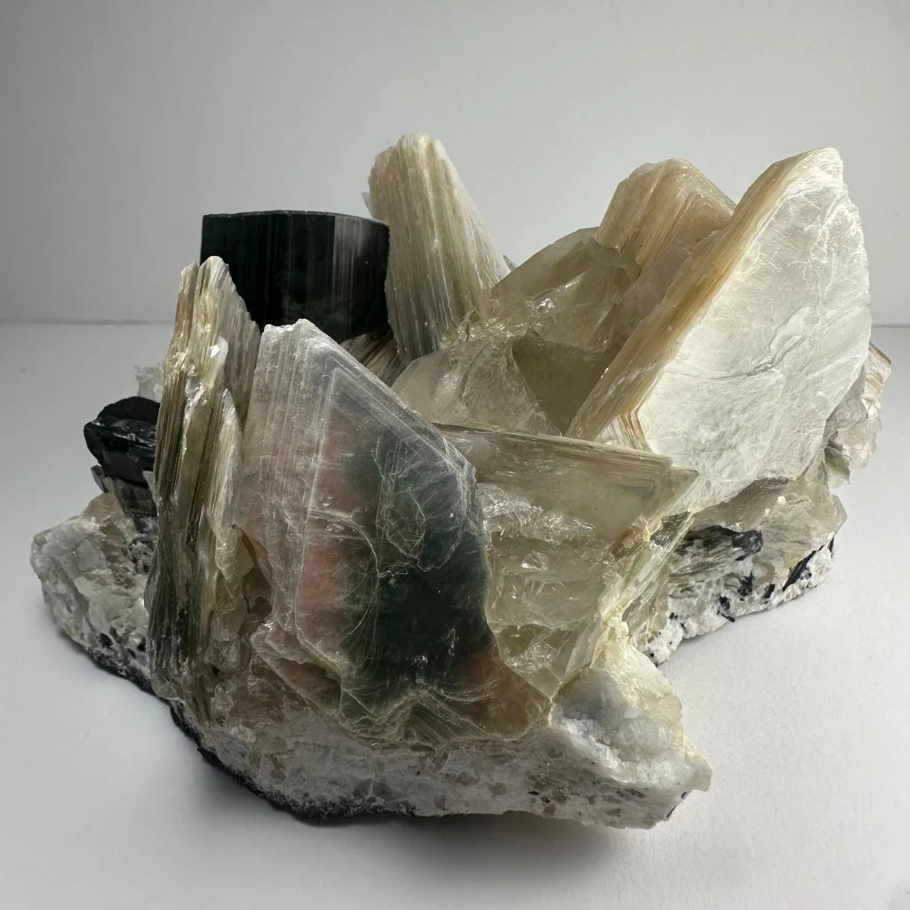 Rare indicolite tourmaline crystal from Afghanistan with green-white translucent formations
