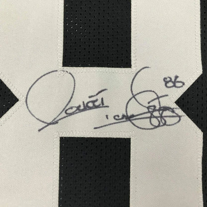 Autographed black and white striped custom jersey from a professional sports league