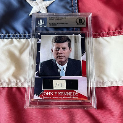 A framed custom trading card featuring a rare jfk handwritten word from united states president john f kennedy