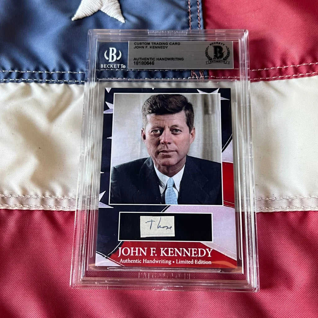 A framed custom trading card featuring a rare jfk handwritten word and kennedy autograph from united states president