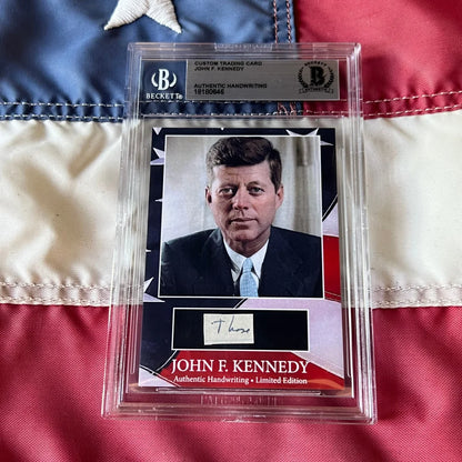A framed custom trading card featuring a rare jfk handwritten word and kennedy autograph from united states president