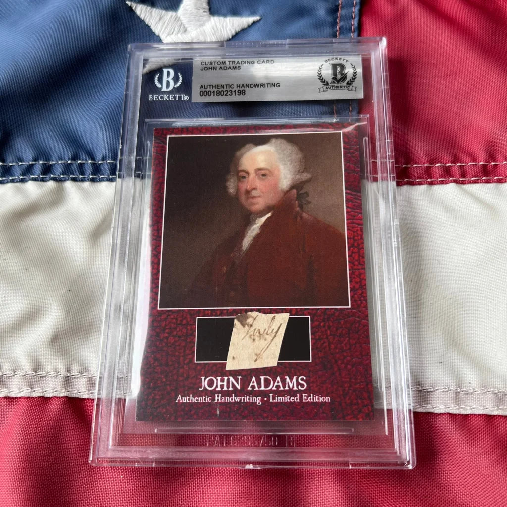 Beckett-authenticated limited edition rare john adams handwriting cards on red textured background featuring adams legal document