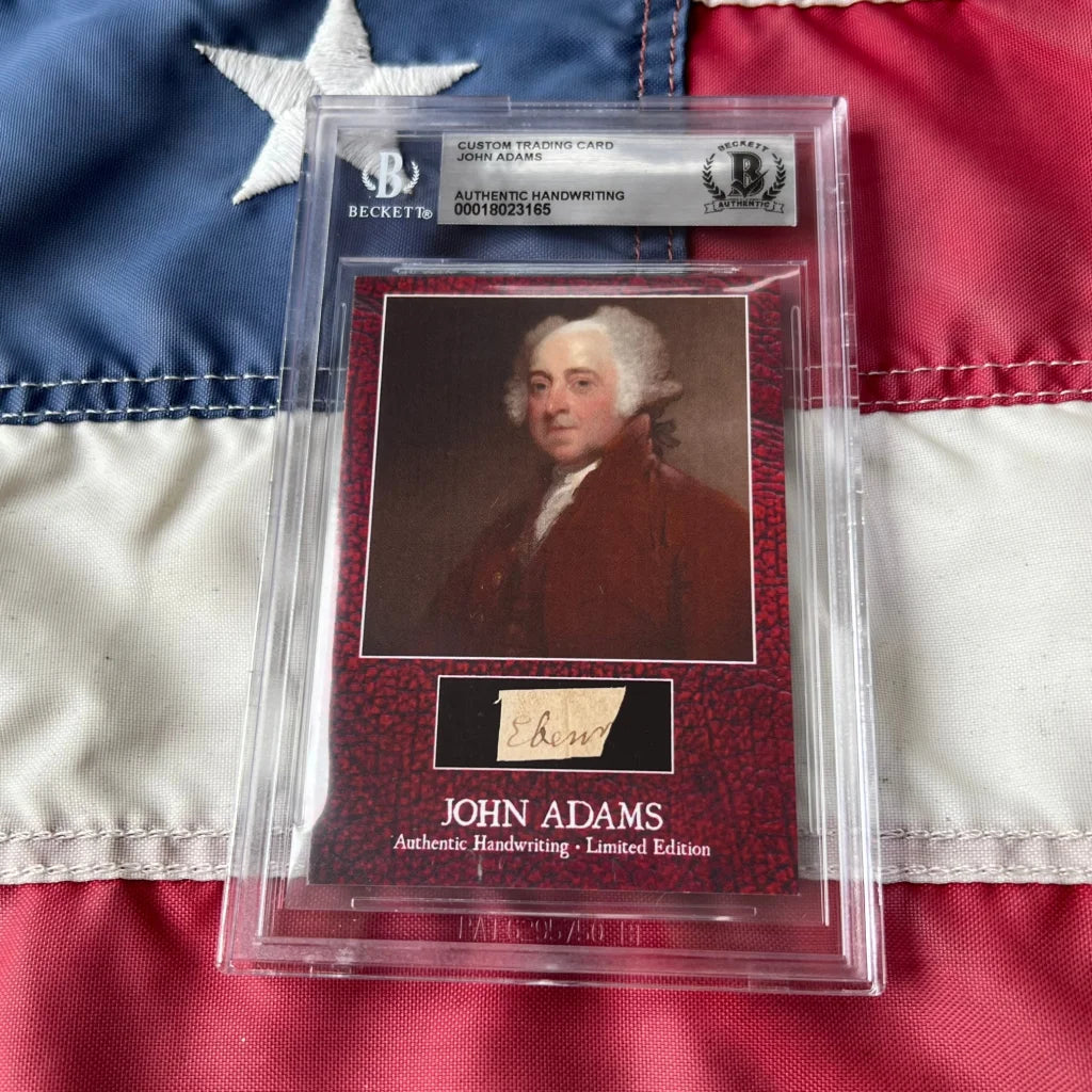 A rare John Adams framed handwriting card on deep red textured cardboard featuring his legal document sample