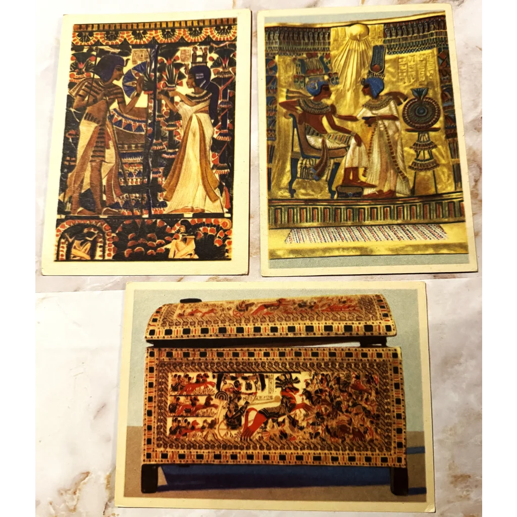 Three Egyptian art prints with hieroglyphs and a chest from the King Tut collection