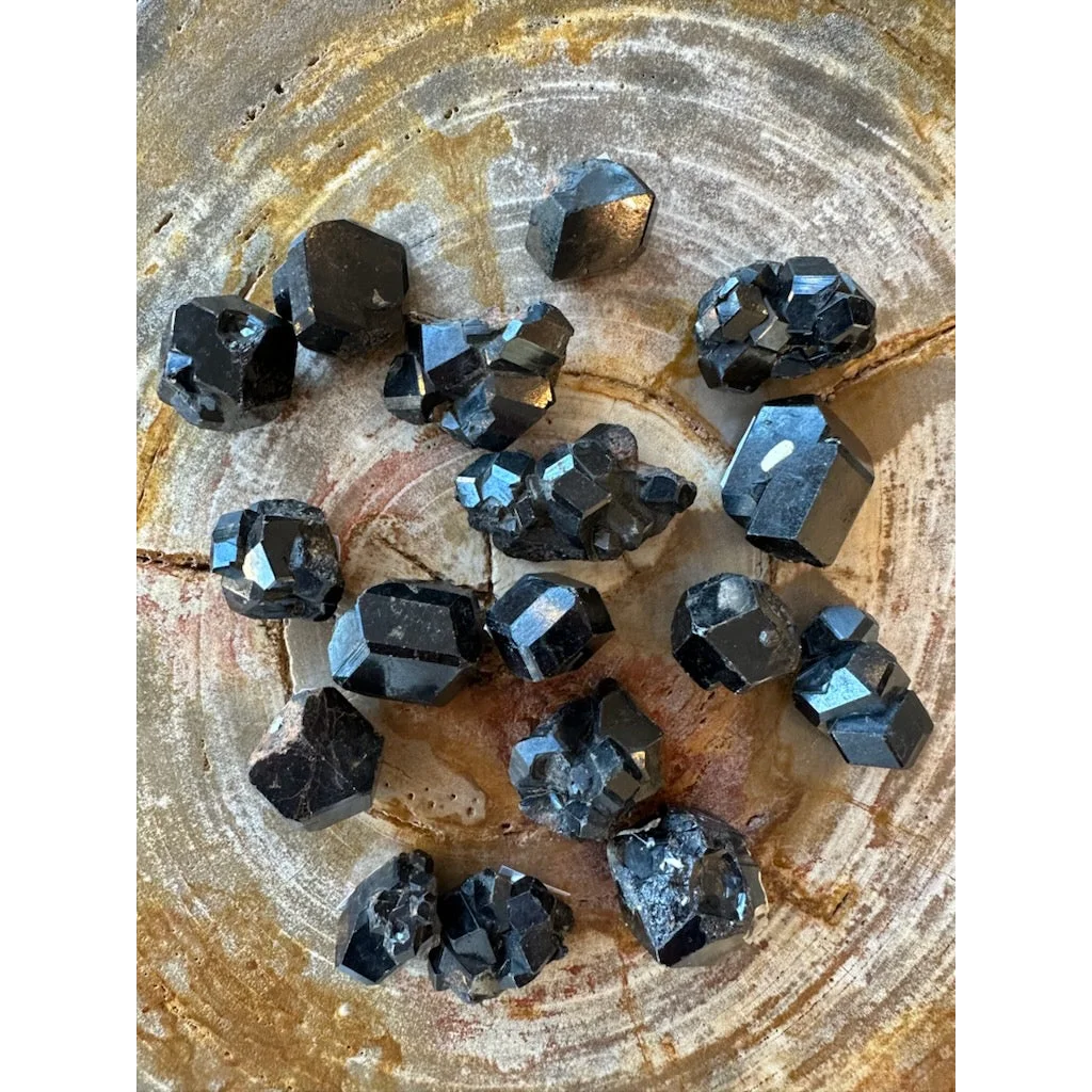 Black pyrite crystals with metallic sheen on wood, rare melanite garnet from Kayes region
