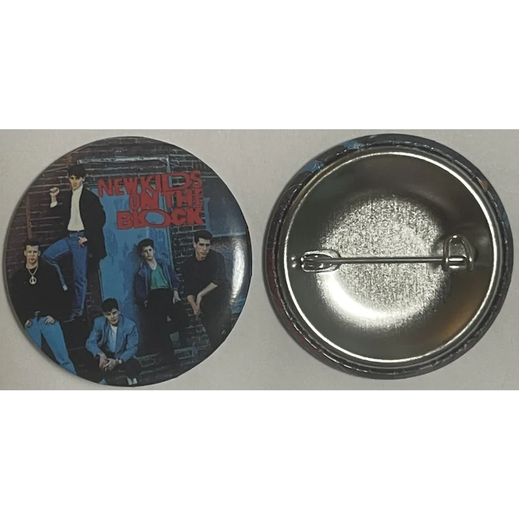 Circular pin-back button showcasing New Kids on the Block, celebrating this iconic boy band