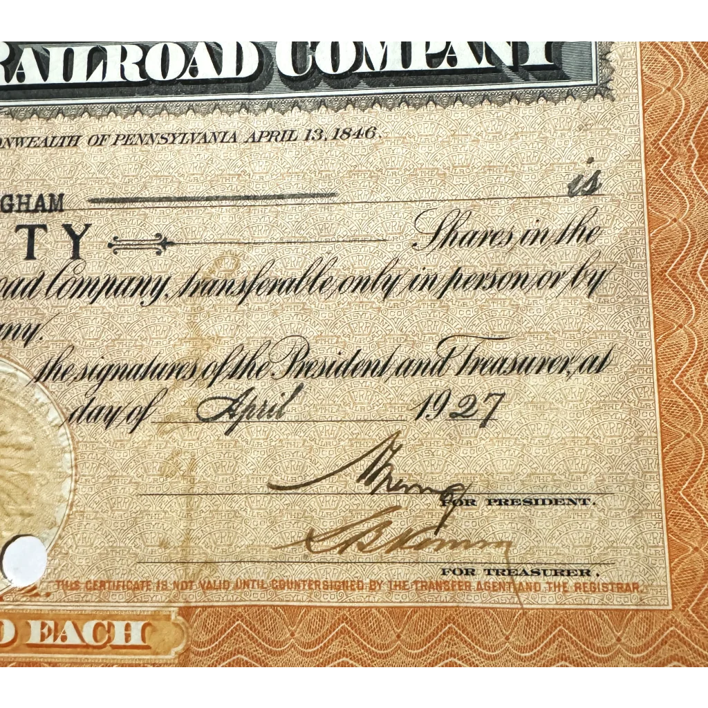 Vintage 1927 Pennsylvania Railroad stock certificate from the 1950s in orange