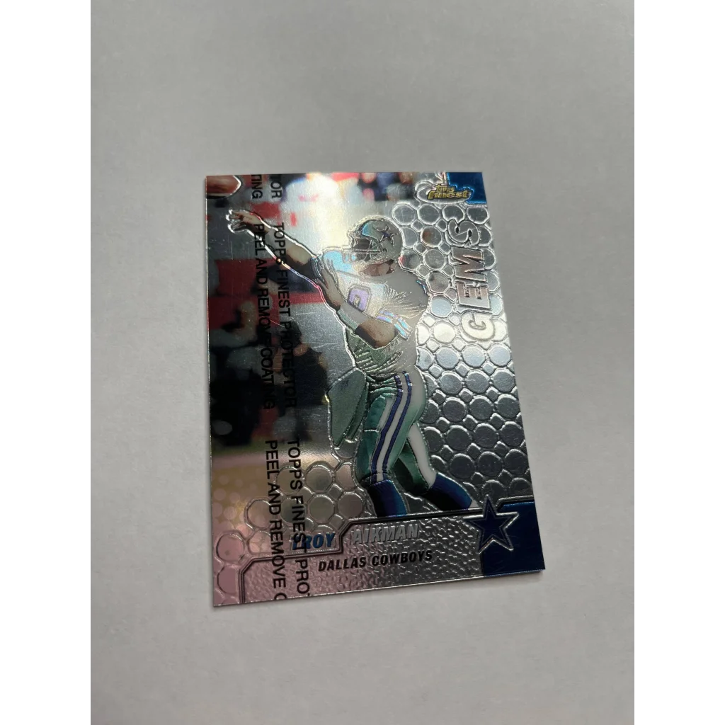 Shiny embossed Troy Aikman card 1999 Topps Finest featuring a throwing stance