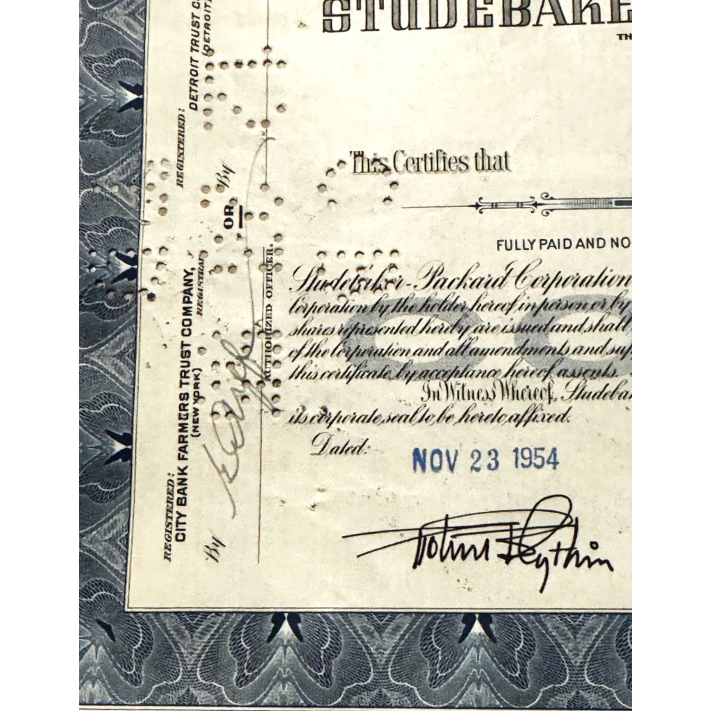 Vintage Studebaker stock certificate from 1954, featuring signature and classic design