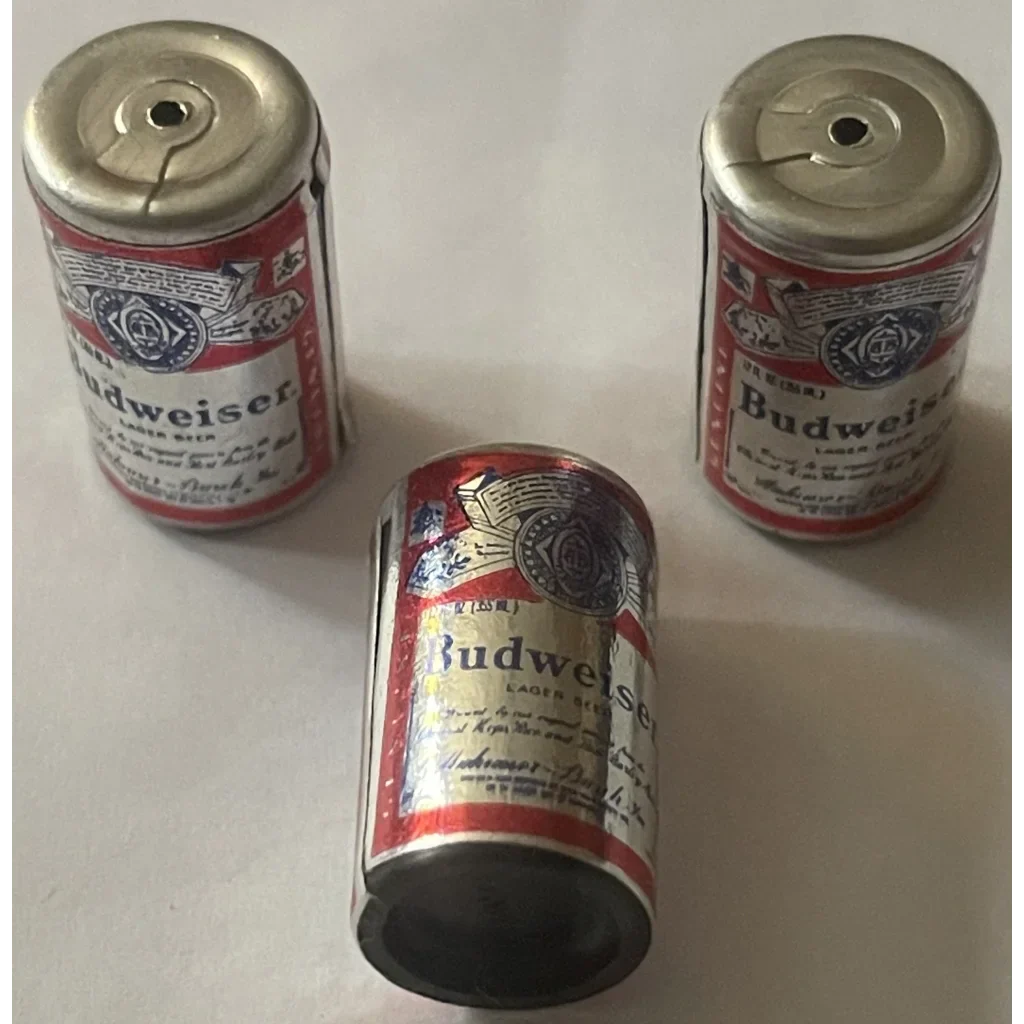 Three mini Budweiser beer cans in a cool triangular setup for a vintage gift